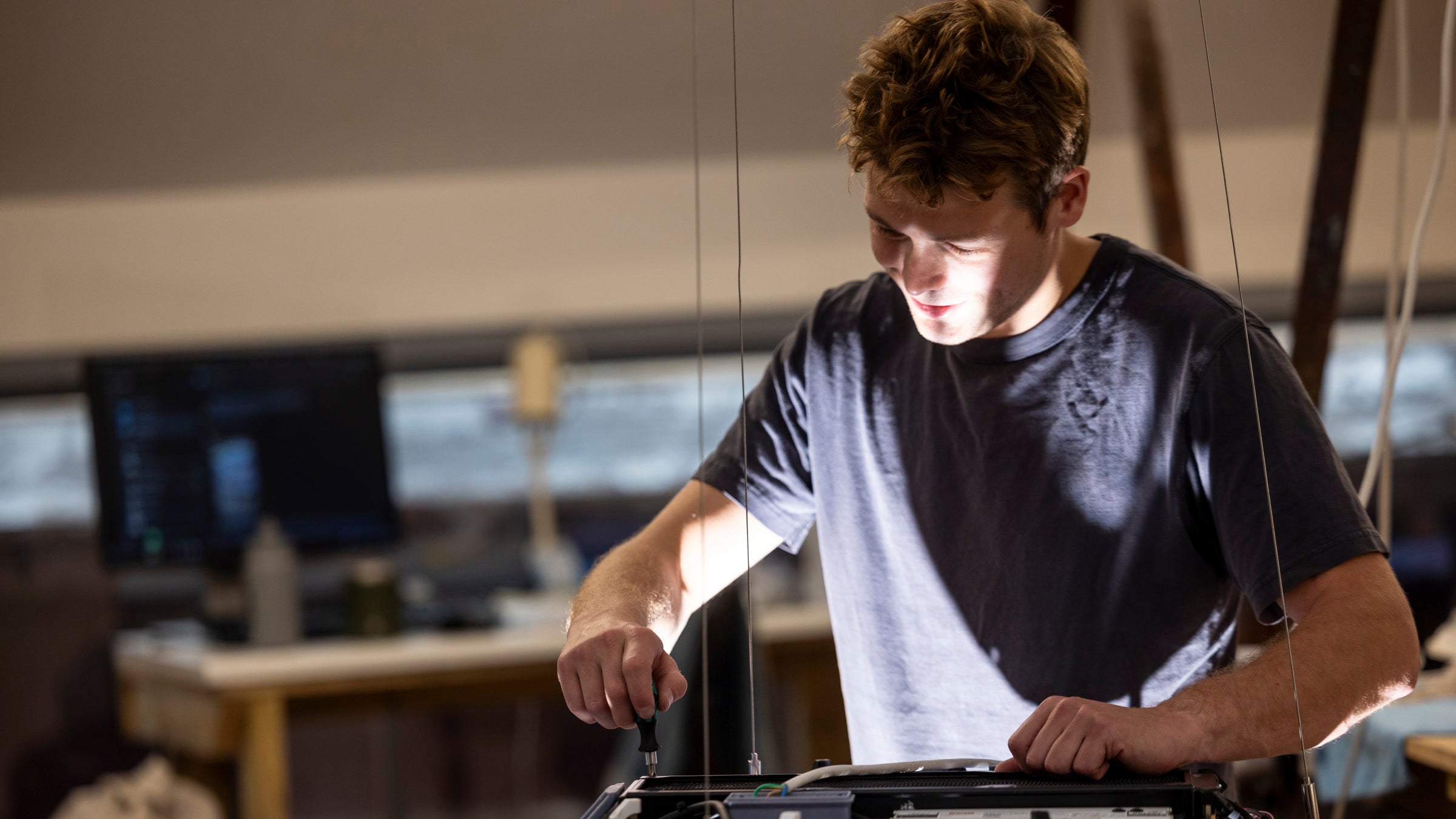 Nat Martin building a Sunday Light in the London workshop